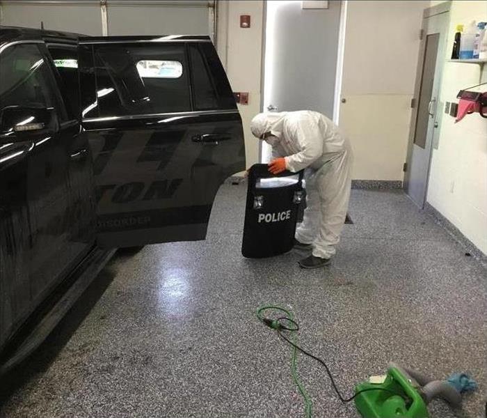tech in ppp cleaning police shield 