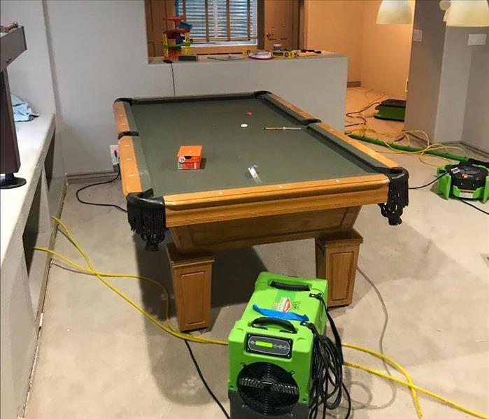 SERVPRO equipment setup to dry a residential basement