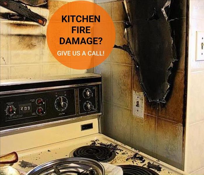 stove with fire debris, black burned hole in wall